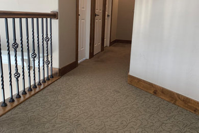 Hallway - traditional carpeted and brown floor hallway idea in Salt Lake City with beige walls