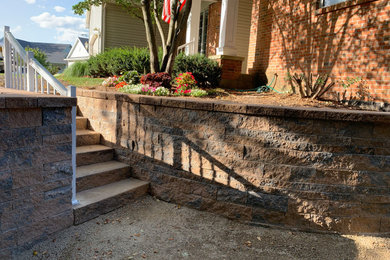 Inspiration for a small contemporary partial sun side yard gravel retaining wall landscape for summer.