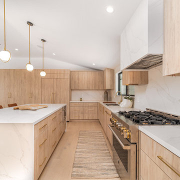 Range and Marble Backsplash Between Island and Wall Run