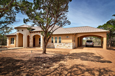 Example of a tuscan exterior home design in Austin