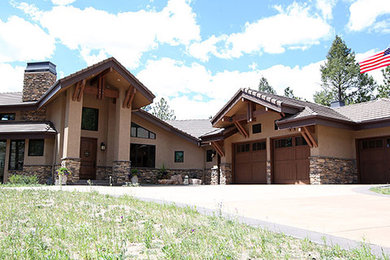 Rustic exterior home idea in Denver