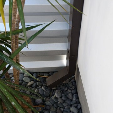 Costa Mesa, New Modern Home. Angle Face 5 inch Gutters, Smooth Downspouts.