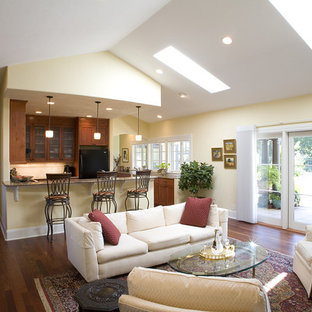 Mediterranean open plan living room in Seattle with yellow walls.