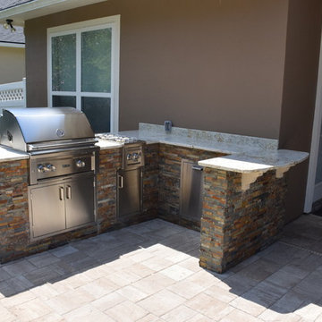 Outdoor kitchen with separate server area.