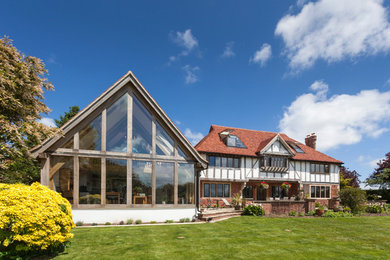 Design ideas for a large traditional brick white exterior in Hampshire.
