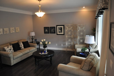 Living room - mid-sized traditional formal and enclosed dark wood floor living room idea in Philadelphia with gray walls, no fireplace and no tv