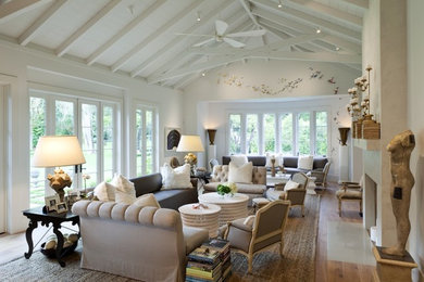 Living room - transitional formal medium tone wood floor living room idea in San Francisco with white walls, a standard fireplace and no tv