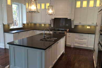 This is an example of a contemporary kitchen in Toronto with a double-bowl sink, grey splashback, stone slab splashback and an island.