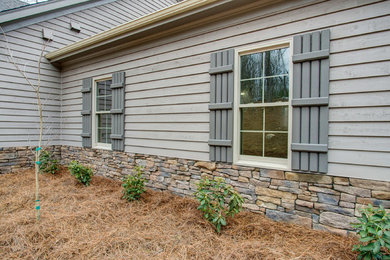 Mountain style home design photo in Raleigh