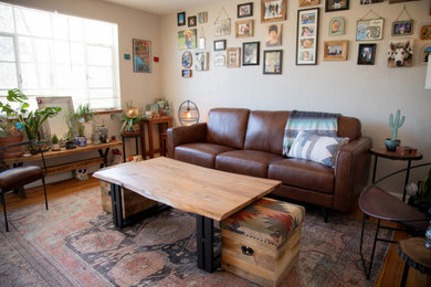 Living room - eclectic living room idea in Denver with beige walls