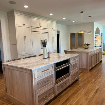 Frameless white perimeter with rift cut oak islands