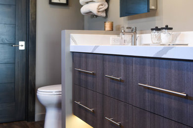 Inspiration for a transitional bathroom remodel in Salt Lake City with flat-panel cabinets and quartz countertops