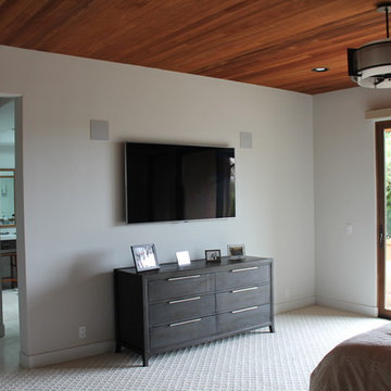 Contemporary look in Master Bedroom with hidden audio/video equipment