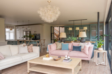 Inspiration for a large traditional living room in Berkshire with white walls, vinyl flooring, no tv and brown floors.