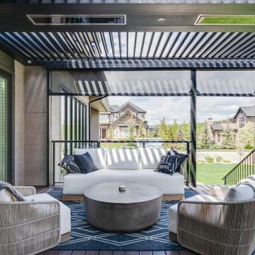 Adjustable StruXure Pergola Featuring Outdoor Kitchen With Screens & Heaters