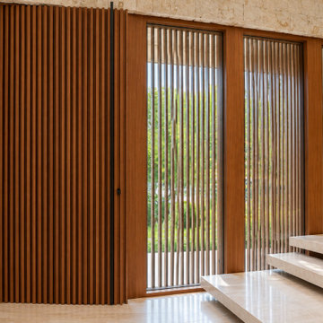 Vertical Wood Slat Cladding & Glass Entry Panels | Golden Beach