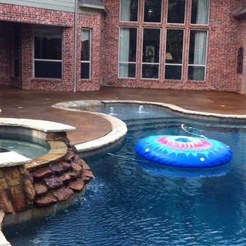 Stained Pool Deck Complements Brick Facade
