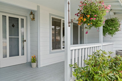 Example of a large gray one-story house exterior design in Seattle