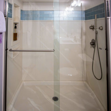 Guest Bathroom Featuring White Icing Vanity and Alabaster Marble Shower