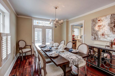 Mid-sized elegant dark wood floor and brown floor great room photo in Toronto with yellow walls and a standard fireplace