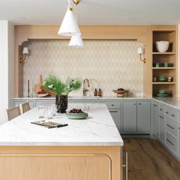 Lower-Level Kitchen with Sage Green Cabinetry & Oak Island