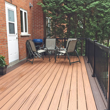 Tiki Torch Decking With Lava Rock Picture Frame and Cedar Wood Skirting