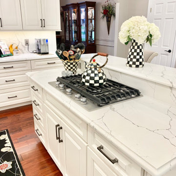 Ivory White Kitchen With Marble Look Quartz Counters and Splash