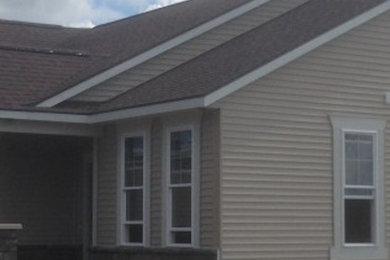 Inspiration for a transitional exterior home remodel in Grand Rapids
