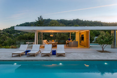 Inspiration for a large modern backyard concrete and rectangular lap pool remodel in San Francisco