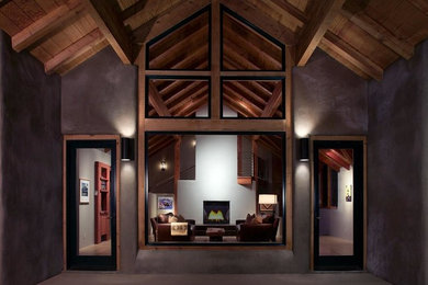 Living room - contemporary open concept dark wood floor and brown floor living room idea in Phoenix with gray walls, a two-sided fireplace, a concrete fireplace and no tv