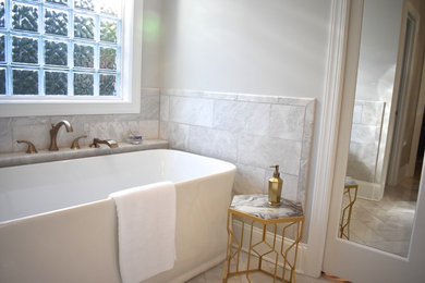 Inspiration for a large transitional master gray tile and marble tile marble floor and gray floor bathroom remodel in Charlotte with recessed-panel cabinets, blue cabinets, a two-piece toilet, gray walls, an undermount sink, quartz countertops, a hinged shower door and white countertops