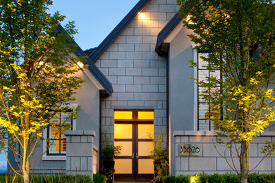 Photo of a transitional entryway in Vancouver with a double front door and a glass front door.