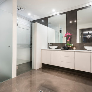 Contemporary bathroom in Perth with flat-panel cabinets, white cabinets, white tile, a vessel sink, grey floor and white benchtops.