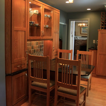 Cohesive Transitional Kitchen | Cherry Cabinets & Black Granite Table