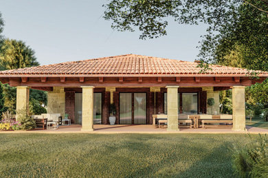 Diseño de terraza de estilo de casa de campo en patio trasero