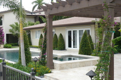 Photo of a large tropical home design in Miami.