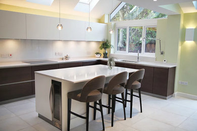 Example of a minimalist dining room design in Hertfordshire