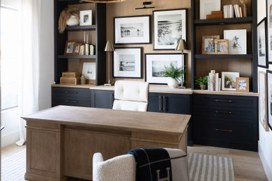 Study room - mid-sized coastal built-in desk coffered ceiling study room idea in Phoenix with white walls