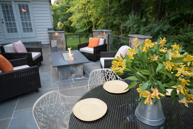 Inspiration for a mid-sized contemporary backyard patio in DC Metro with a fire feature and no cover.