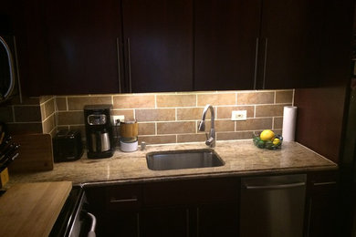 This is an example of a small modern kitchen in New York.