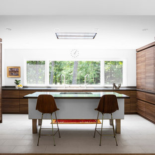 Mid-sized mid-century modern kitchen pantry pictures - Kitchen pantry - mid-sized 1960s u-shaped porcelain tile and white floor kitchen pantry idea in Indianapolis with a triple-bowl sink, flat-panel cabinets, medium tone wood cabinets, quartz countertops, gray backsplash, quartz backsplash, paneled appliances, an island and gray countertops