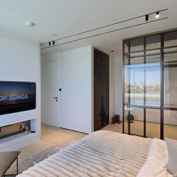 Bedroom with Built-In TV Wall and Glass Partition