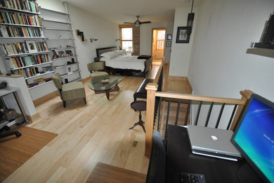 Bedroom - large contemporary loft-style light wood floor bedroom idea in Baltimore with white walls