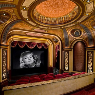 This is an example of a mediterranean home cinema in Orange County with carpet and a projector screen.