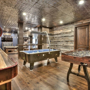 Inspiration for an expansive rustic look-out basement in Denver with blue walls, medium hardwood flooring and no fireplace.
