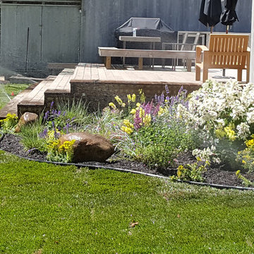 Backyard Makeover Installing Sod, Privacy Hedge, Flower Garden, Gravel Driveway