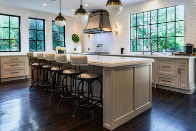Large elegant l-shaped dark wood floor and brown floor kitchen photo in Chicago with an undermount sink, beaded inset cabinets, beige cabinets, quartz countertops, white backsplash, porcelain backsplash, stainless steel appliances, an island and white countertops