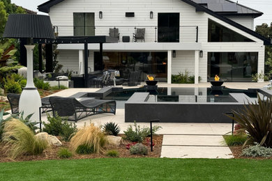 Patio - large contemporary backyard patio idea in Los Angeles