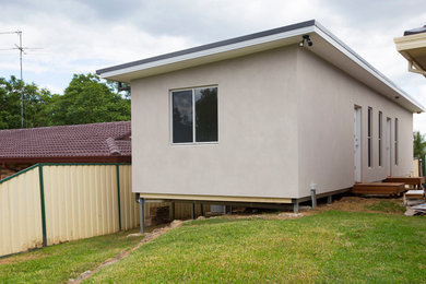 Inspiration for a modern home design in Newcastle - Maitland.