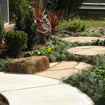Landscaping with oversize pavers and backyard creek - hkns